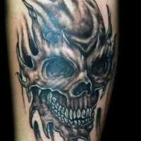 Skull black ink tattoo on leg