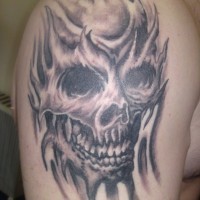 Skull in waves tattoo