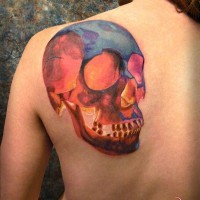 Watercolour skull tattoo on the back