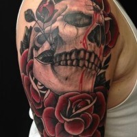 Skull with a bullet hole in forehead and red roses tattoo