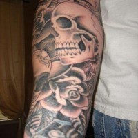 Skull with roses forearm tattoo photo