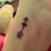 Small arrow tattoo with heart
