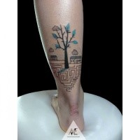 Small beautiful looking ankle tattoo of small tree with labyrinth