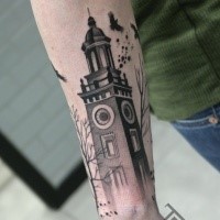 Small black ink arm tattoo of big old tower