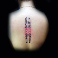Small black ink back tattoo of tribal ornament