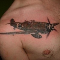 Small black ink chest tattoo of very detailed WW2 fighter plane