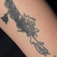 Small black ink hummingbird tattoo