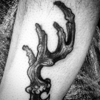 Small black ink leg tattoo of typical elk horn