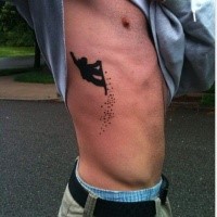 Small blackwork style side tattoo of snowboarder
