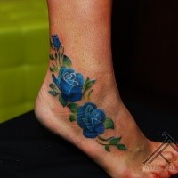 Small blue colored ankle tattoo of large roses