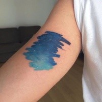 Small blue colored arm tattoo of night sky