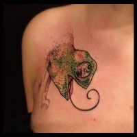 Small cartoon style colored chest tattoo of chameleon lizard