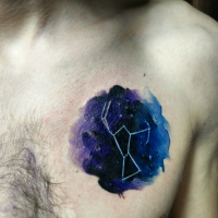 Small colored chest tattoo of star figure in dark sky