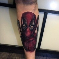 Small colored leg tattoo of angry Deadpool portrait