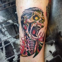 Small colored old school forearm tattoo of bloody zombie skeleton