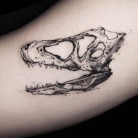 Small dot style arm tattoo of animal skull