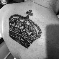 Small engraving style black ink back tattoo of beautiful crown