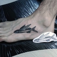 Small flying fish detailed tattoo on foot