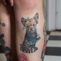 Small illustrative style colored leg tattoo of funny dog and lettering