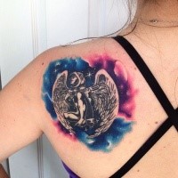 Small illustrative style colored smape angel tattoo on shoulder