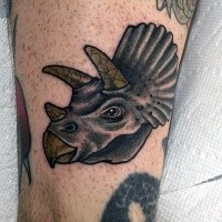 Small new school style colored funny dinosaur head tattoo on arm