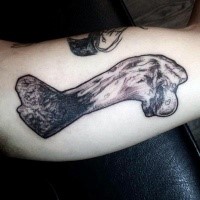 Small nice looking colored human bone tattoo on arm