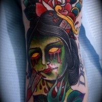 Small old school style colored bloody zombie head tattoo on foot with flowers and bloody