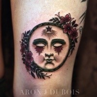 Small old school style tattoo of fantasy face with flowers