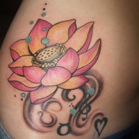 Small pink lotus flower tattoo on ribs