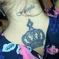 Small script and crown tattoo on back
