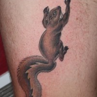 Small squirrel clumbing up tattoo