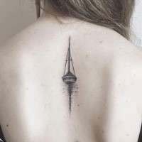 Small stippling style back tattoo of sailing ship