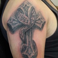 Snake on cross tattoo on arm