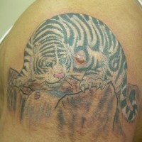 Snow tiger on mountain tattoo