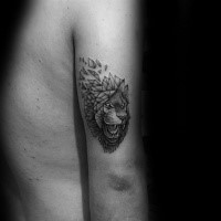 Sone like black ink arm tattoo of demonic lion head