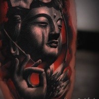Spectacular amazing colored thigh tattoo of Buddha statue