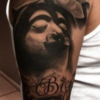 Spectacular black and white sleeve tattoo of creepy looking ancient statue with lettering