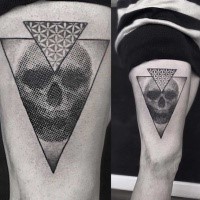 Spectacular black ink thigh tattoo of stippling style skull with triangles
