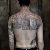 Spectacular black ink very detailed antic city tattoo on upper back with mountains