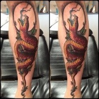 Spectacular colored arm tattoo of evil snake with leaves