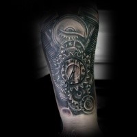 Spectacular colored engine stylized with clock tattoo on forearm