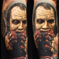 Spectacular colored horror style arm tattoo of zombie with bloody hands