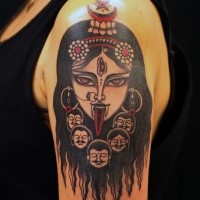 Spectacular colored shoulder tattoo of demonic woman with creepy faces and tongue