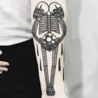Spectacular funny looking forearm tattoo of alien with two heads