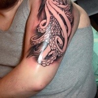 Spectacular illustrative style black ink shoulder tattoo of octopus