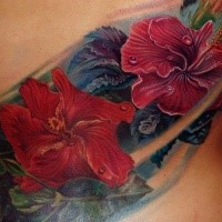 Spectacular large back tattoo of various beautiful flowers