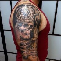 Spectacular looking shoulder tattoo of skeleton king with wine glass