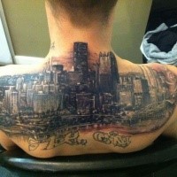 Spectacular multicolored upper back tattoo of big city sights and lettering