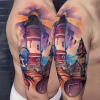 Spectacular painted nice colored lighthouse tattoo on shoulder combined with antic city