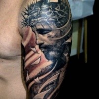 Spectacular religious style colored shoulder tattoo of dramatic Jesus portrait